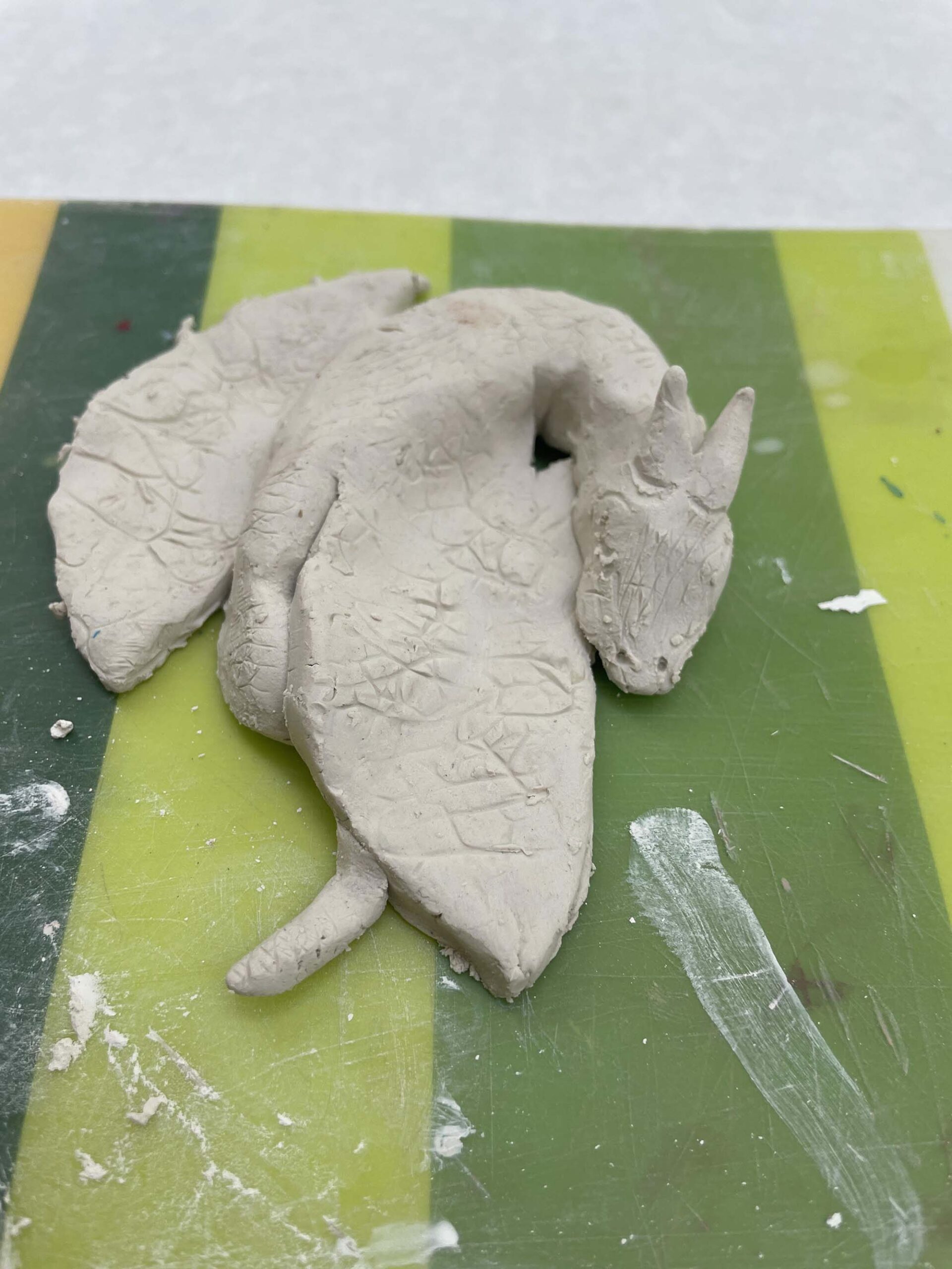 A sleeping dragon made of clay.